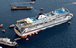 Passengers are transferred from the listing cruise ship Sea Diamond, carrying nearly 1,200 passengers, to a rescue vessel during the evacuation effort in Santorini