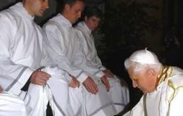 Pope Benedict washed and dried the feet of 12 men at a traditional Holy Thursday service
