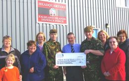 Kevin Ormond (centre) of SAMA82 receives the cheque from (l-r) Wanda and Demi Greenough, Iris Dickson, Saphena Berntsen, Cpl Tom Blake, Cpl Geds Ford, Violet Clarke, Colleen Ford and Ellen Davis.