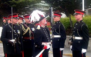 Governor Alan Huckle inspecting FIFD Guard of Honour