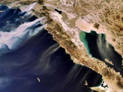 A European Space Agency photo shows desert winds blowing smoke from wildfires in Southern California