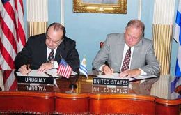 Minister Fernandez and Secretary Shannon signing the Memorandum