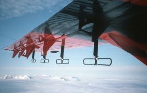 The ice penetrating radar attached to the Twin Otter aircraft wing