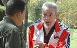 Fidel Castro talks with Pte. Hugo Chavez