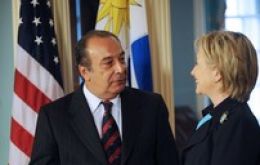 Secretary of State Hillary Clinton  (R) welcome  Uruguay's Foreign Affairs minister Gonzalo Fernandez