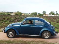 Pte. Mujica driving his old blue Fusca (Photo El Pais)