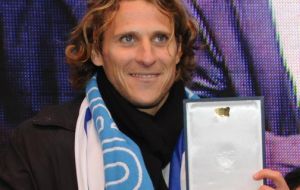 World’s Cup's best player Diego Forlan receive a medal with the Uruguayan crest 