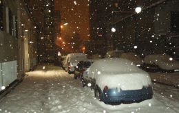 Cars covered in snow in central Chile 