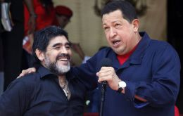 President Chavez next to visiting Argentine coach Diego Maradona on making the announcement