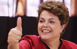Dilma Rousseff making the victory signal after voting early Sunday