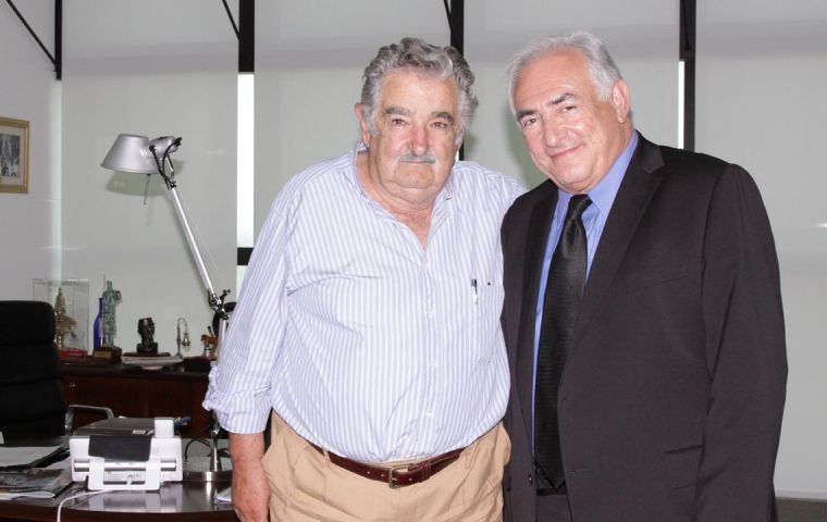 Strauss-Khan with Uruguayan President Jose Pepe Mujica (L)