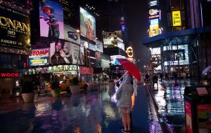 The looming threat of Hurricane Irene did not dissuade some tourists from visiting Manhattan's Times Square on Saturday (AP)