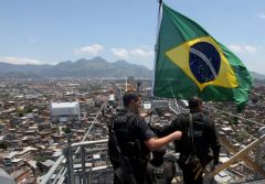 The Brazilian flag flies over Rocinha, the most notorious favela which is home to 150.000 people  