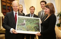 Minister Bellingham with an image of a yellow-nosed albatross