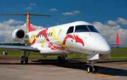 Embraer Brand Ambassador with his Legacy 650 painted with a dragon logo 