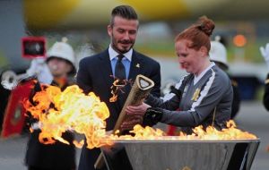 David Beckham lit a cauldron, to mark the flame's arrival on UK soil.