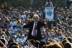 Gustavo Santaolalla conducting the youth international orchestra during the inauguration ceremonies in Puerto Iguaz&uacute;, Argentina