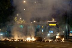 Hooded vandals set on fire public transport buses
