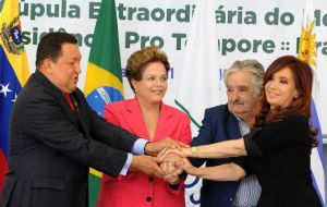 Chavez (and his oil-dollars) greeted by fellow leaders from Mercosur  