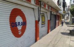 Shopkeepers are closing earlier and late evening masses have been suspended 