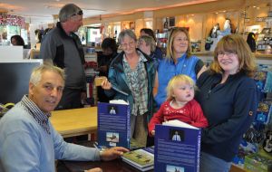 Patrick Watts signing copies of his newly published book 'The Christmas Sports' at the Capstan gift shop in Stanley.