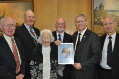 Andrew Rosindell MP with members of the FIA Executive Committee and the portrait of Her Majesty which he has presented to FIA