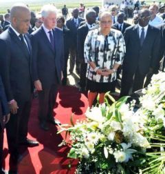 President Michel Martelly and former president Clinton as the sombre ceremony 