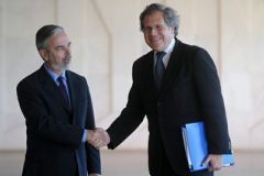 Foreign minister Almagro shakes hands with his Brazilian peer Antonio Patriota (left)