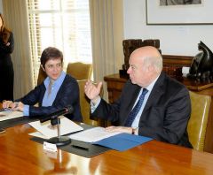 OAS Secretary General Insulza and Permanent Representative of Ecuador María Isabel Salvador (L) during the signing ceremony