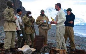 The crew testing the whisky to toast a t Shackleton's grave