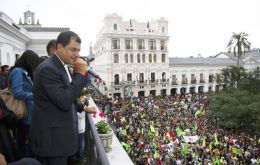 The Ecuadorean president waves to the packed crowd from Carondelet palace 