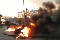 Pickets set on fire posters and Falklands related material with the &lsquo;Star Princess&rsquo; in the background  