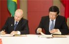 Guido Mantega and Lou Jiwei of China signed the ambitious agreement