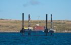 The jack-up barge and deck-mounted core drill machine on location in Port William (Photo courtesy by C. Harris)