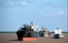 Tens of ships lined up along the Parana and River Place waiting to load