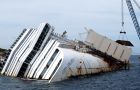 The cruise vessel in being recovered from the rocks where she remains