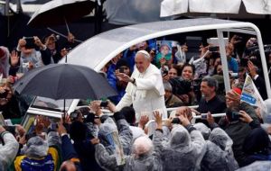 Tens of thousands turned out for Francis’ mass despite the cold and rain