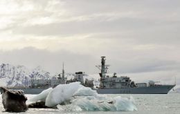 The Type 23 frigate sailing among icy landscape in the extreme south Atlantic
