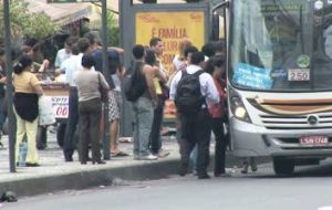 Crowds of people at bus stops in Rio do Janeiro