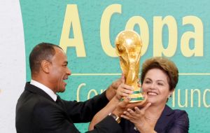 Touching wood and vowing to keep her fingers crossed, Dilma said she was confident in Brazil's chances at the World Cup.