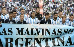 'Las Malvinas son Argentinas', before kick-off in a friendly against Slovenia in La Plata on June 7.