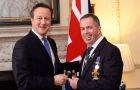 PM Cameron in Downing Street hands the medals to the veterans (Pic PA)