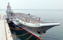 China's first aircraft carrier, the Liaoning, docks at a military port in Qingdao in east China's Shandong province.