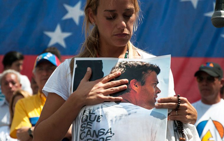 Lopez’s wife, Lilian Tintori, gathered with a small group of supporters to mark the date of her husband’s arrest, and asked Venezuelans to show their support
