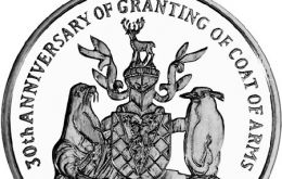 The coin, struck by the Pobjoy Mint, on behalf of the Treasury of South Georgia & the South Sandwich Islands includes the Coat of Arms.
