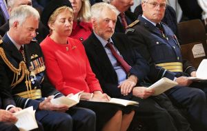 Corbyn sat next to RAF senior members, including ACM Sir Andrew Pulford, and other politicians, PM David Cameron and Defence Secretary Fallon.