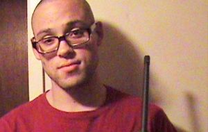 A picture of him holding a rifle appeared on a MySpace page with a post expressing a deep interest in the Irish Republican Army.