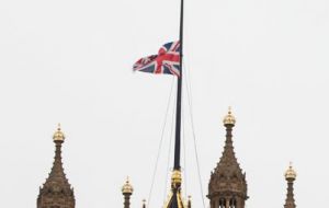 Britain's Union Jack flag was flying at half-mast over the Houses of Parliament in London, while in Birstall hundreds of people attended a vigil at a local church.