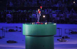 Prime Minister Shinzo Abe and Super Mario emerge from a green pipe in the middle of the Maracana Arena
