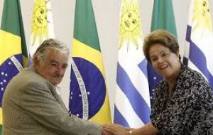The removed Brazilian president with a long time friend, Jose Mujica  during an official ceremony 